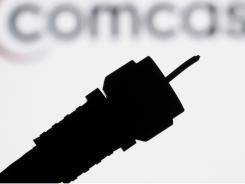 Image for Comcast bumps up speed for home-Internet users [telecom]